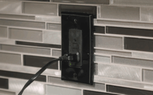 An image of a GCFI electrical outlet in a kitchen